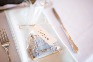 walnut ink place card tags attached to suitcase cookies